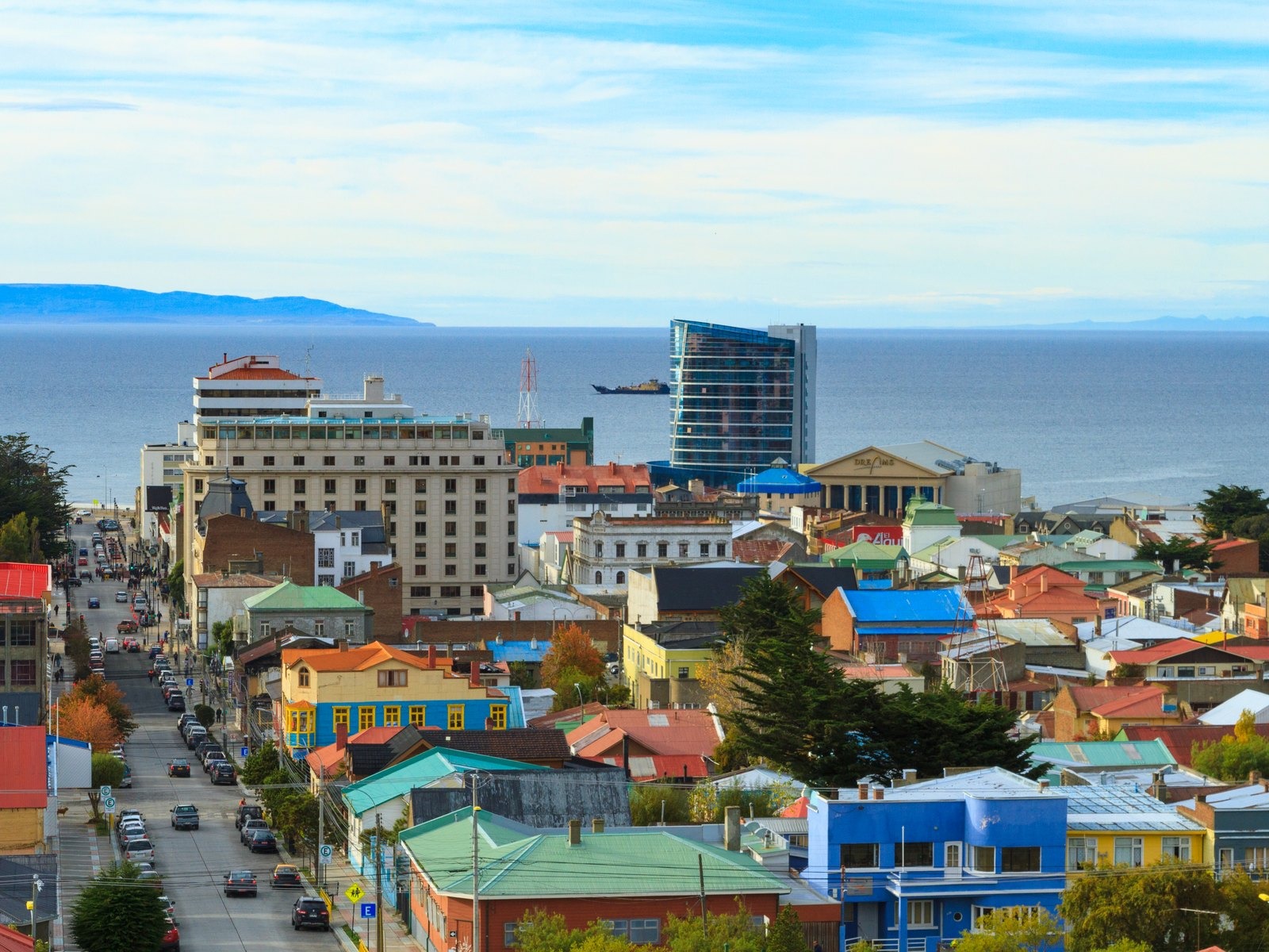 Panoramic view of Punta Arenas, the departure city for Antarctica cruises from Chile, with the Strait of Magellan in the background.